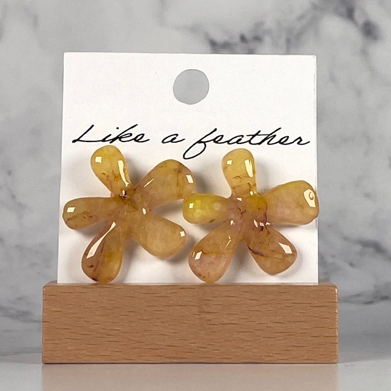 stud earrings shaped like flower, in yellow color.