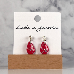 dangling earrings shaped like drop, in red, silver color.