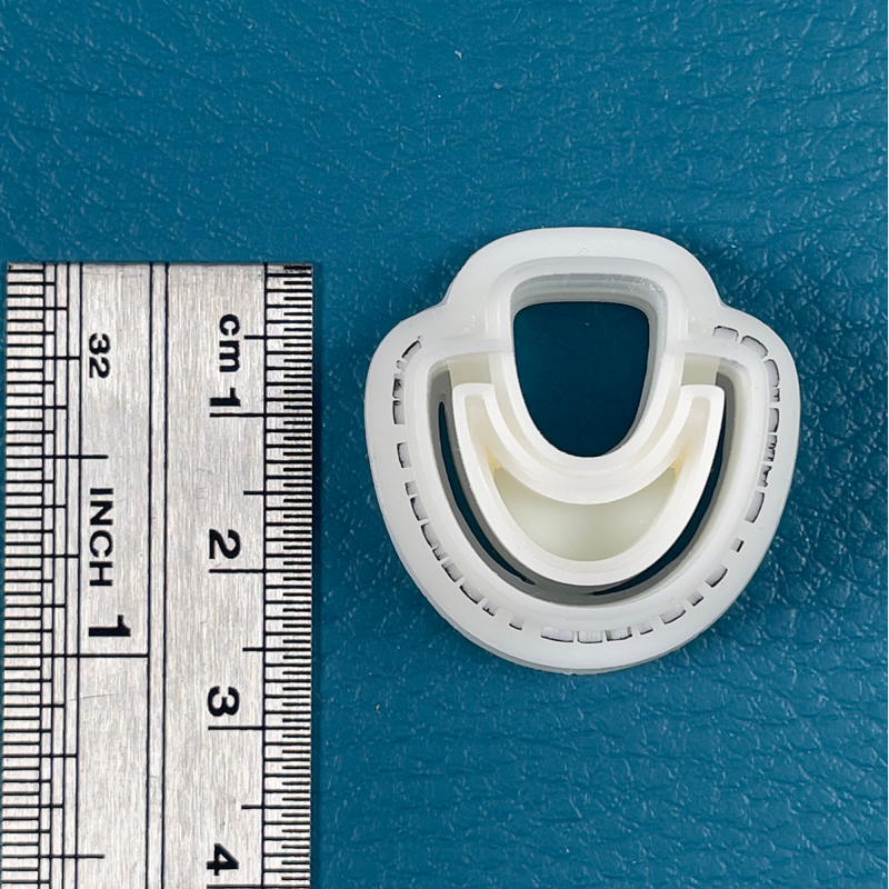 Cutter in the shape of door knocker in the shape of a drop (