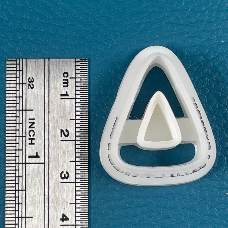 Cutter in form van doorboorde driehoek (Verschillende beschi