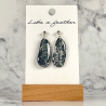 dangling earrings shaped like pebble, in black, white, silve