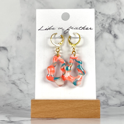 dangling earrings shaped like organic, in rose, blue, white