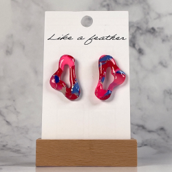stud earrings shaped like organic, in red, neon pink, blue a