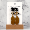 dangling earrings shaped like organic, in beige, black, sand