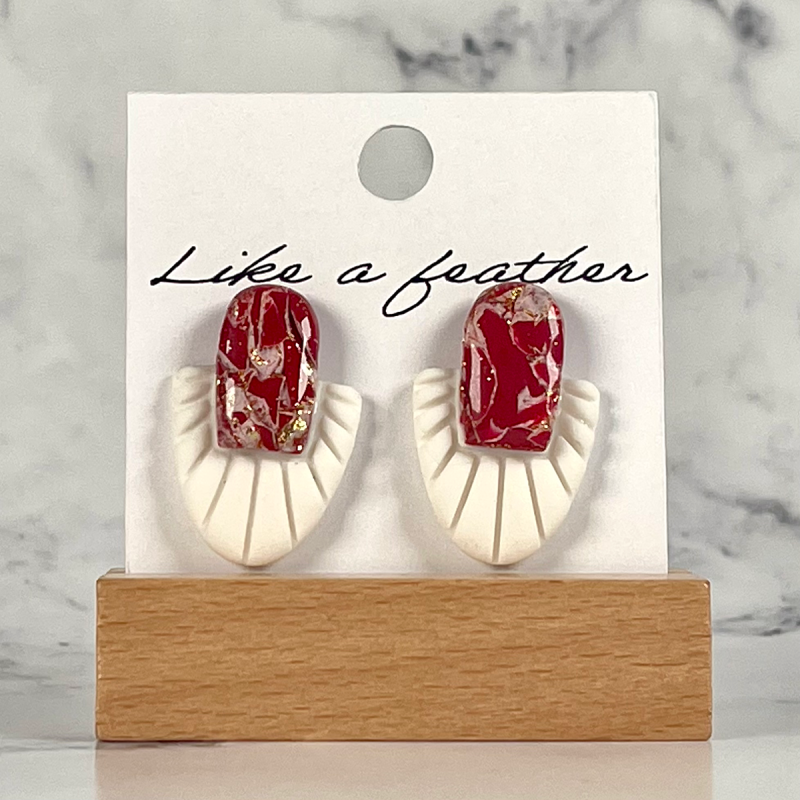 stud earrings shaped like two opposing half-ovals, in burgun