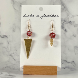 dangling earrings, in golden, burgundy, white colors.