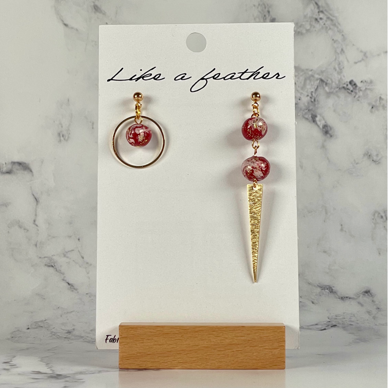 dangling earrings, in golden, burgundy, white colors.