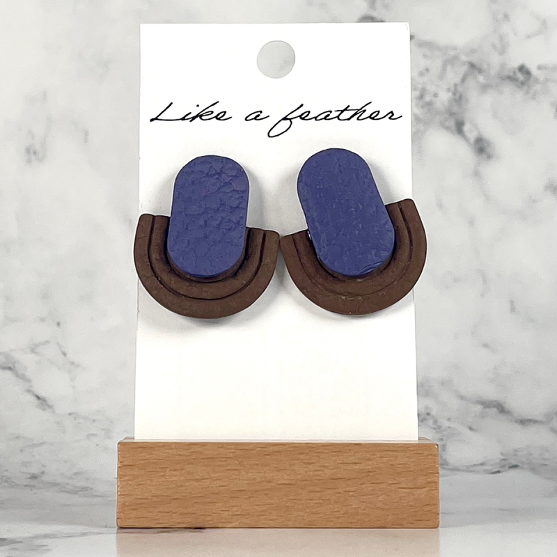 stud earrings shaped like half-oval and oval, in purple, bro