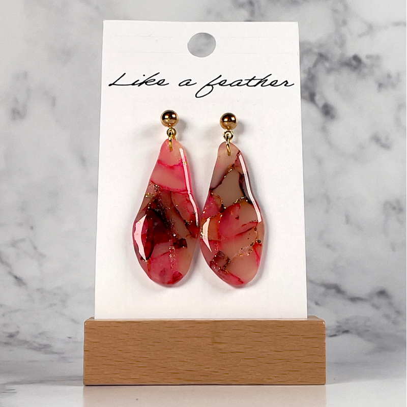 dangling earrings shaped like organic, in neon pink, dark ch
