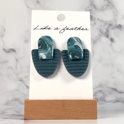 stud earrings, in teal blue, white, silver color.