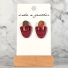 stud earrings shaped like half-oval and oval, in burgundy, m
