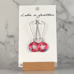 dangling earrings shaped like pierced round, in red, neon pi