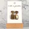 dangling earrings shaped like pebble, in khaki, beige color.