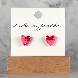 stud earrings shaped like heart, in neon pink, red color.