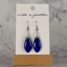 dangling earrings shaped like drop, in blue, white, grey col
