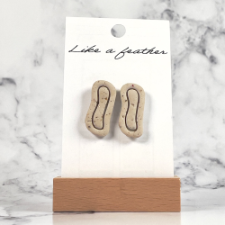stud earrings shaped like organic, in sand color.