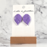 stud earrings shaped like flower bud, in purple color.