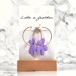 hoop earrings shaped like flower, in purple color.