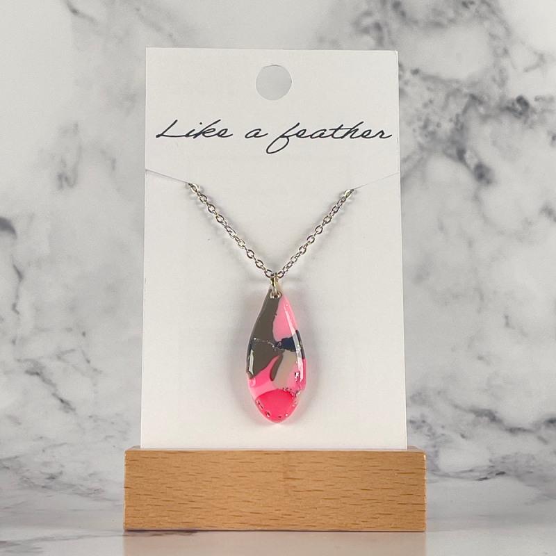 Drop-shaped pendant in rose, khaki, silver colors.