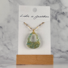 Drop-shaped pendant in turquoise, off white, golden colors.